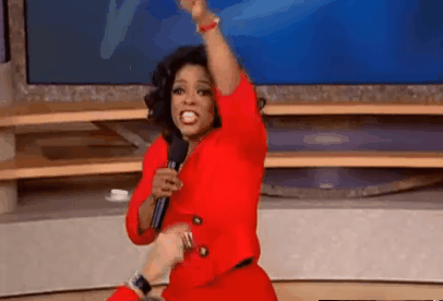 Oprah pointing to audience