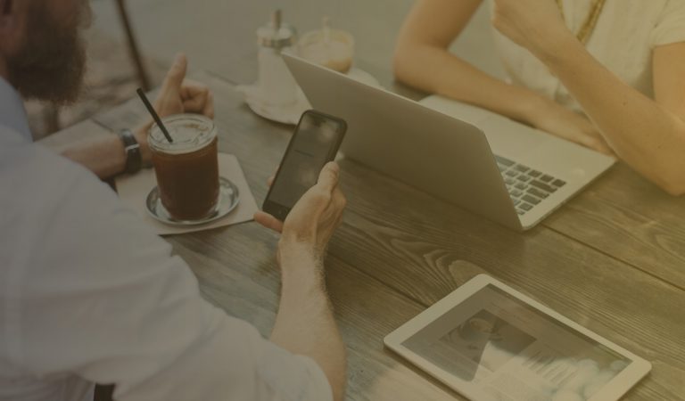 two people having coffee and working